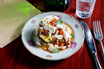 aubergine stuffed with vegetables and cheese