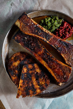 Veal bone marrow with croutons. The cuisine of Tel Aviv.