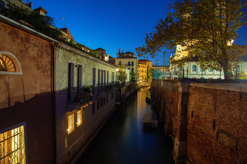 Fototapeta na wymiar Beautiful photo of Venice at night. Light from the lanterns erupts in the canals of Venice