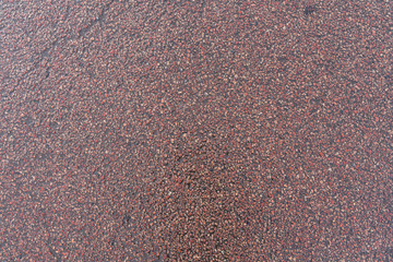wet asphalt. gray coarse fabric