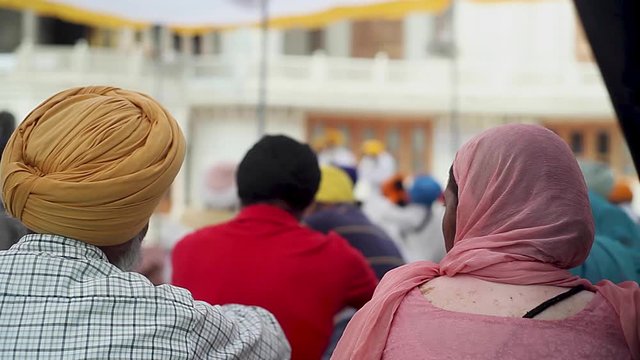 Religious seekers listening to prayers