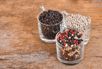 Pepper mix  on wooden background.