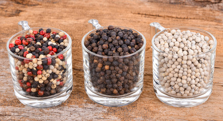 Pepper mix  on wooden background.