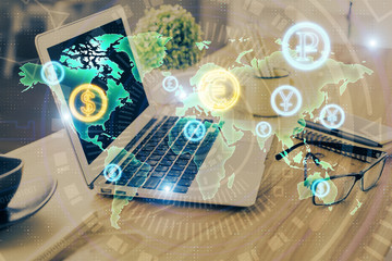 Double exposure of forex chart and work space with computer. Concept of international online trading.