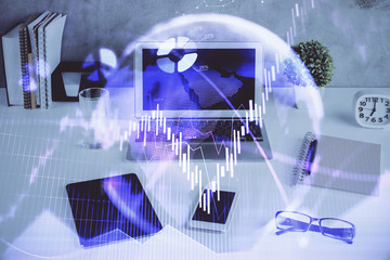 Forex market chart hologram and personal computer background. Multi exposure. Concept of investment.