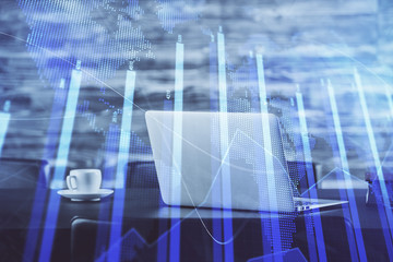 Stock market graph on background with desk and personal computer. Double exposure. Concept of financial analysis.