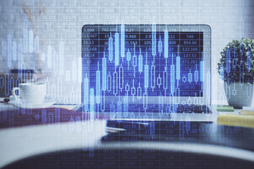 Financial graph colorful drawing and table with computer on background. Double exposure. Concept of international markets.