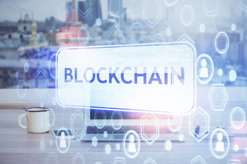 Double exposure of blockchain theme hologram and table with computer background. Concept of bitcoin...