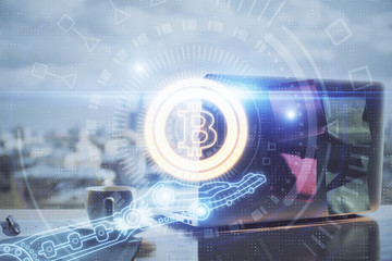 Double exposure of blockchain theme hologram and table with computer background. Concept of bitcoin...