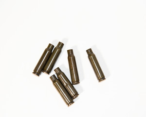 empty shells from cartridges for a firearm on a white background