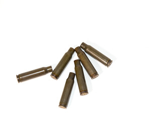 empty shells from cartridges for a firearm on a white background