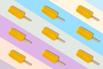 Yellow ice cream on colorful background for minimal and summer background concept.