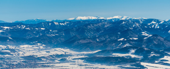 Velka Fatra and highest Nizke Tatry mountains on the background from sedlo Okopy bellow Mincol hill in winter Mala Fatra mountains in Slovakia © honza28683