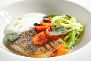 Cod Fillet in Cream Sauce with Vegetable Spaghetti Isolated