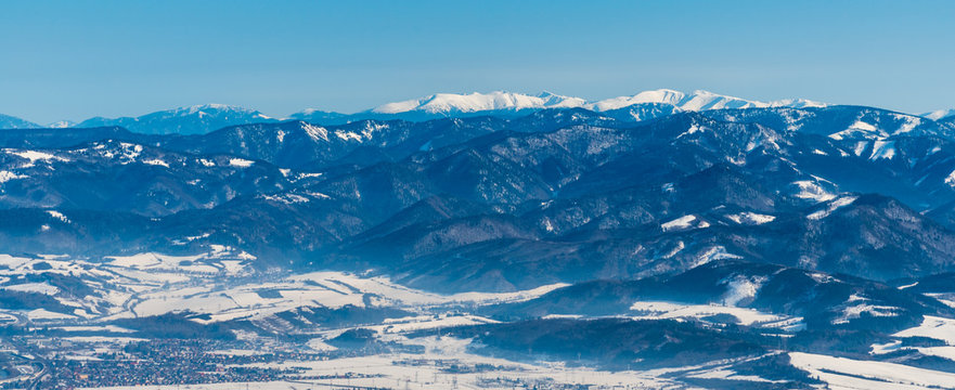 Velka Fatra and highest Nizke Tatry mountains on the background from sedlo Okopy bellow Mincol hill in winter Mala Fatra mountains in Slovakia