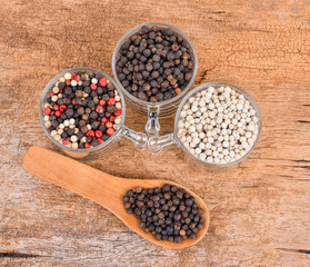 Pepper mix  on wooden background.