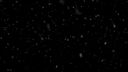Falling slow snow isolated on black background in 4K to be used for composing, motion graphics, Large and small snow snowflakes, Isolated falling snow,