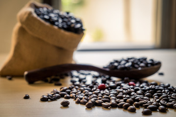 Fototapeta na wymiar coffee beans on wooden table