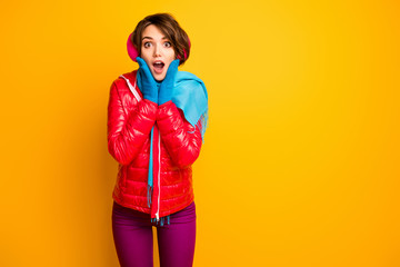 Photo of funny charming lady holding hands on cheekbones read winter sale advert banner wear casual red overcoat blue gloves trousers isolated yellow color background
