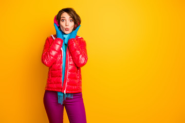 Photo of pretty funny traveler lady winter day ready for walk like nice ear muffs warmth wear stylish casual red overcoat blue scarf pink pants isolated yellow color background