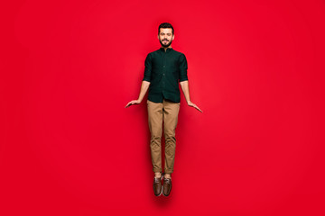 Full body photo of positive cheerful guy have spring free tine relaxation jump wear brown casual...