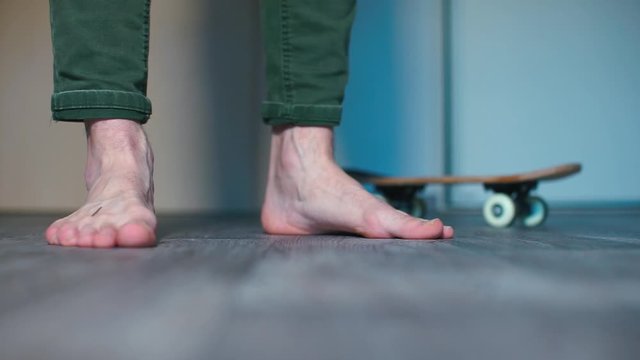 Close-up of a man legs standing on the floor of a room