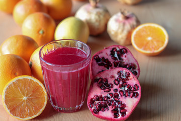 fresh orange and pomegranate juice in a glass