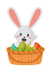 Happy cute bunny in wicker easter basket on white