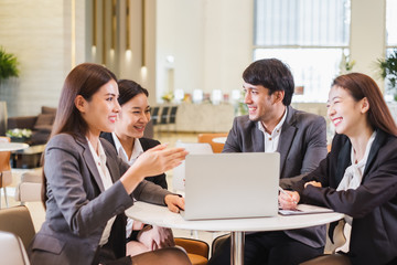Group of Asian business people meeting in office