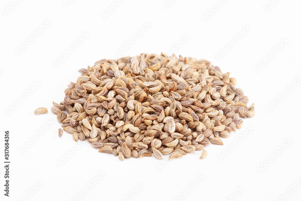 Poster heap of parsley seeds on a white background