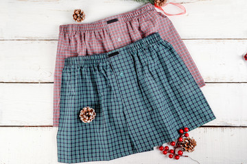 Men's underwear of two colors shot on a white wooden background