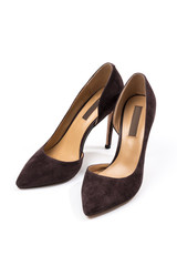 Stylish classic suede women's leather shoes with medium high heels on an isolated white background. Shoe sale / clearance concept announcement.