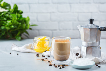 Keto, ketogenic bulletproof coffee with coconut oil and ghee butter
