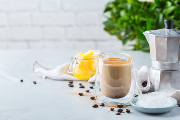 Keto, ketogenic bulletproof coffee with coconut oil and ghee butter