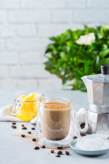 Keto, ketogenic bulletproof coffee with coconut oil and ghee butter