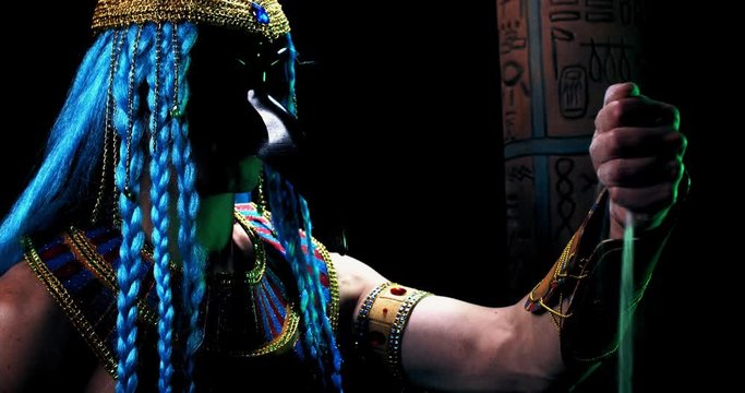 Thoth with blue hair and the head if ibis is pouring sand from his hand, 4k