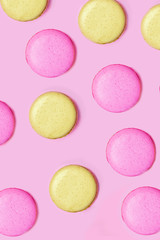 Obraz na płótnie Canvas Seamless pattern made of macaroons on the pink background. Flat lay. Food concept.