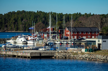 Fototapeta na wymiar April 22, 2018, Stockholm Sweden. Marina for yachts on dwellings island of the Stockholm archipelago in the Baltic Sea in the early morning.