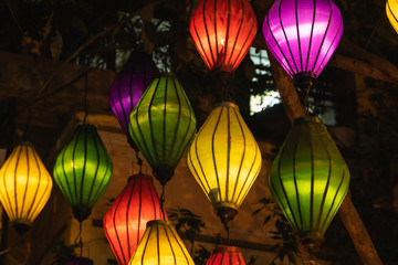 Fototapeta na wymiar Beautiful decoration lanterns light on night market in Hoi An, Vietnam.
