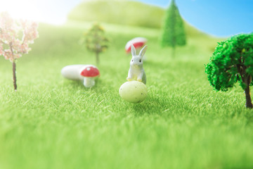 Naklejka premium Spring meadow with rabbit and easter egg. Fairy tale