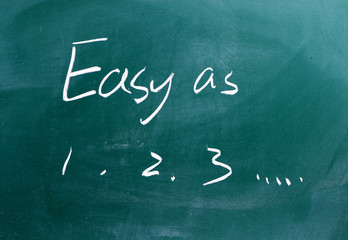 Easy as 1 2 3 phrase written on a chalkboard