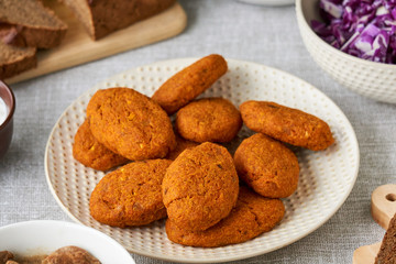 Baked carrot cutlets on a white plate