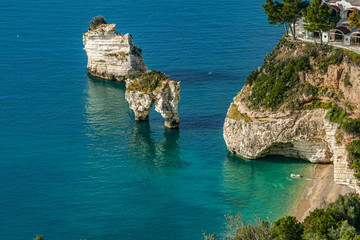 Mattinata Faraglioni stacks and beach coast of Mergoli, Vieste Gargano, Apulia, Italy