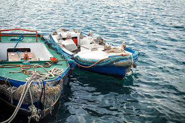 Fototapeta na wymiar fishing boats moored at the pier in harbour of Rovinj town, Croatia.