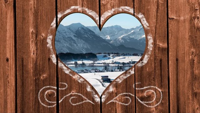 beautiful landscape in Bavaria seen through heart shape in wooden wall