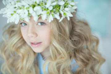 Girl wreath of flowers. Girl with a wreath of flowers on her head.