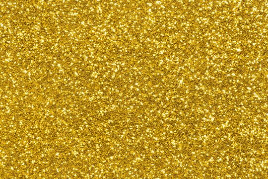 Gold glitter background. Holiday sparkle lights
