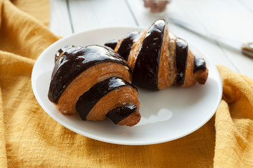 Croissant Croissant with chocolate. Puff pastry bagel. Traditional european pastries. French cuisine