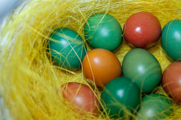 Colored Easter eggs in basket. Selective focus.
