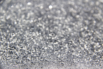 A composition with  beautiful silver glitter. Background and texture of silver glitter. Luxury silver glitter sparkle shining texture background